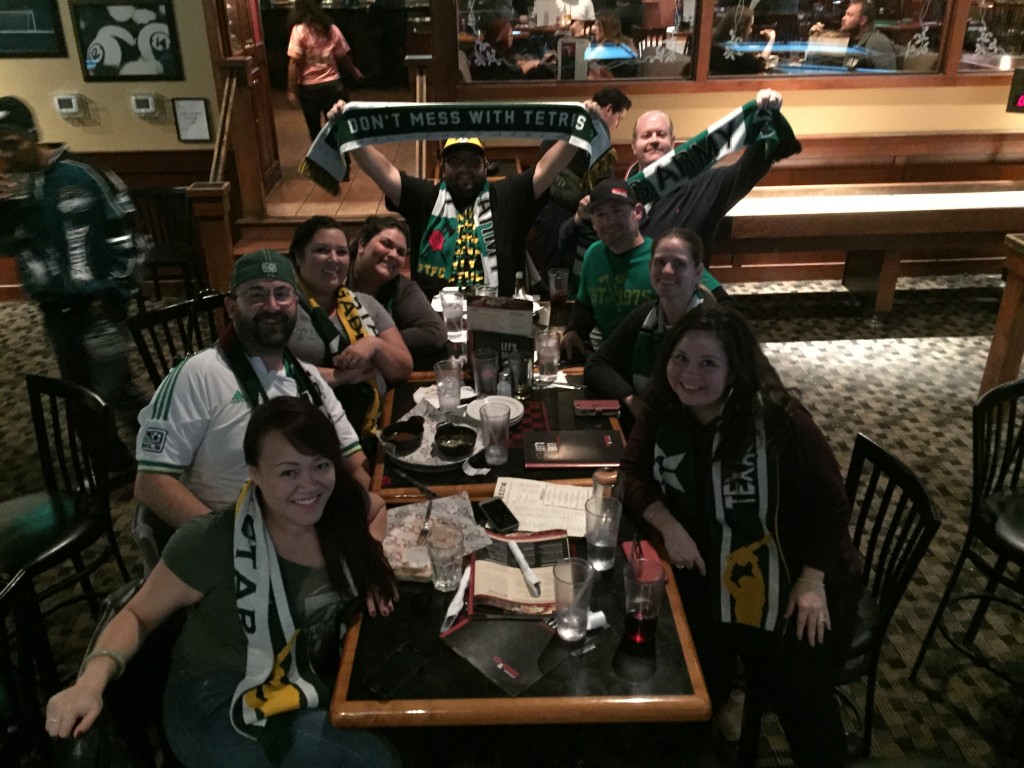 At the Fox and Hound, Dallas. Pictured from front left clockwise: Nancy Song, Kyle McGee, Christie Lee, Molly Diamond, Bryant Ramirez, David Snyder, Erik Ritter, Dionne Ritter, and Maryann Graham Snyder.